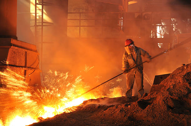 istock Man in a mask performing iron-making duties in a fiery pit 182775263