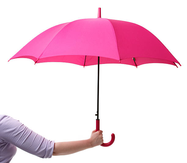 Pink umbrella in hand