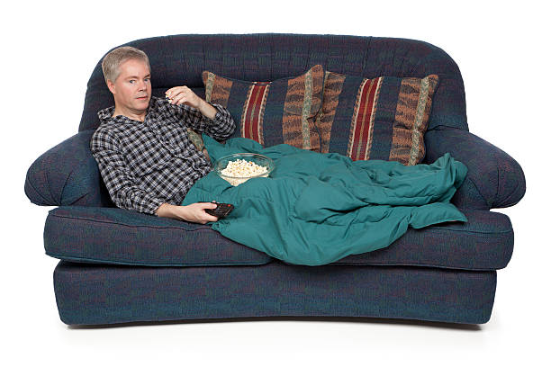 istock Man Eating Popcorn and Watching TV 182776207