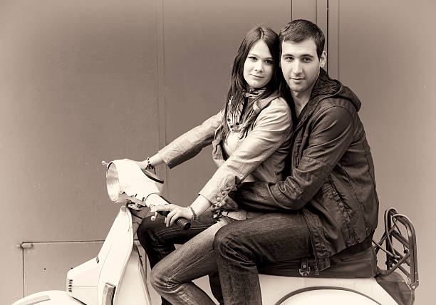 istock Young Couple on a Scooter, monochromatic, sepia tonee 182777171