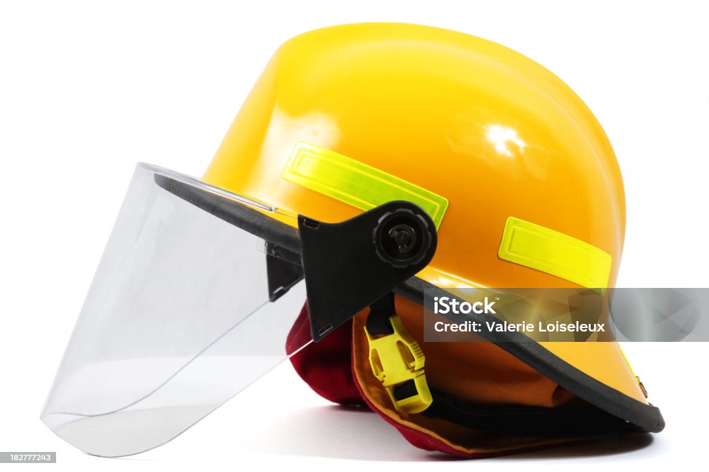Firefighter's helmet Yellow firefighter's helmet with helmet visor on a white background. Firefighter Stock Photo