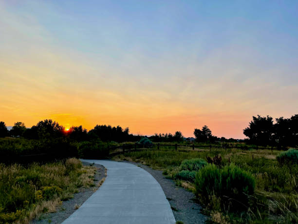 istock Sun Sets Over Walkway in Public Park, Westminster, Colorado (USA) 1827780686