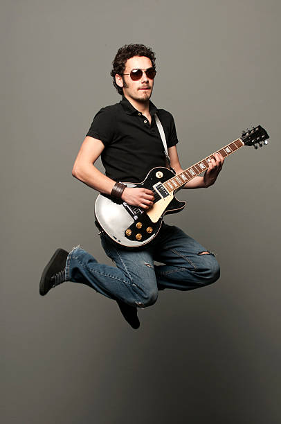 Flying Guitarist: Rock Out! stock photo