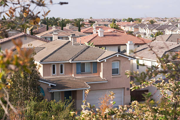 istock Neighborhood Stucco Home Exterior and Sky 182779228