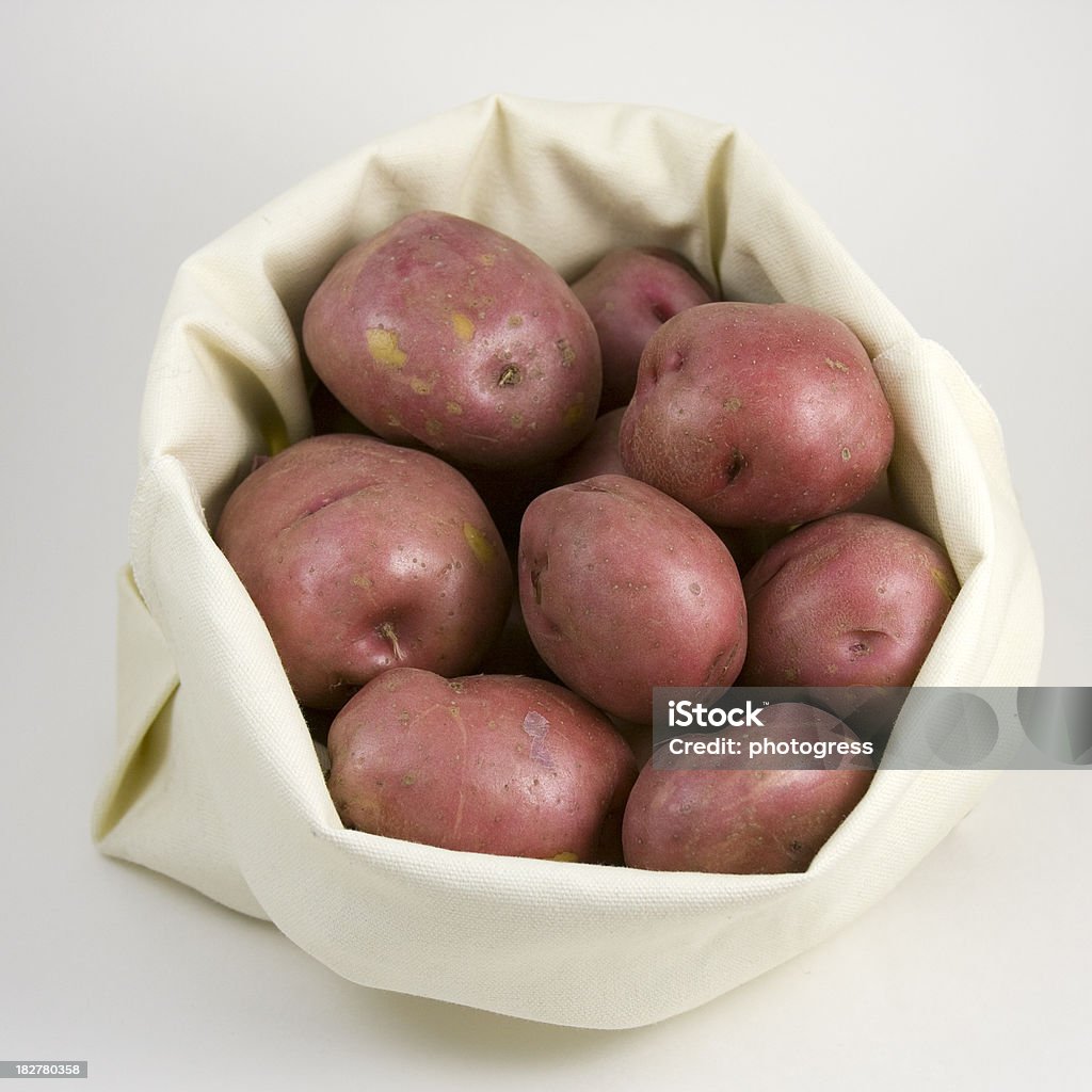 Sacco di patate rosso - Foto stock royalty-free di Borsa