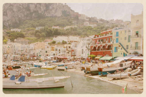 Retro-styled postcard of the Capri waterfront - a popular tourist destination on the Amalfi Coast. All logos and signage have been removed.
