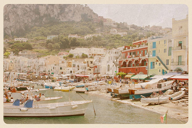 Port of Capri, Italy - VIntage Postcard Retro-styled postcard of the Capri waterfront - a popular tourist destination on the Amalfi Coast. All logos and signage have been removed. southern italy photos stock pictures, royalty-free photos & images
