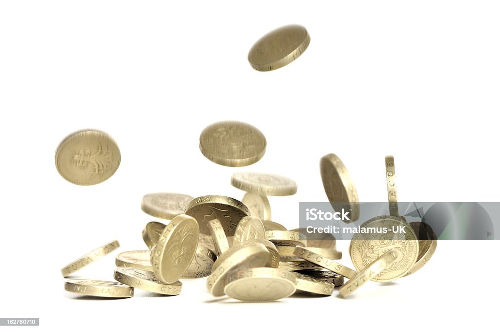 Falling pound coins "British one pound coins falling, isolated on white, no sharpening." Coin Stock Photo