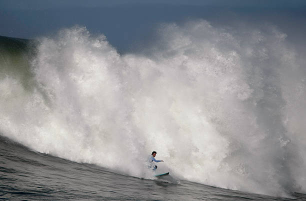 istock Surfing the Spray of a Huge Wave 182781217