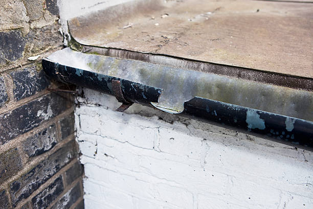 istock cracked rain gutter needing repair 182781243