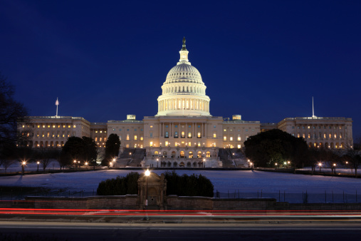 A view of the US Capitol building and the Washington Monument at night