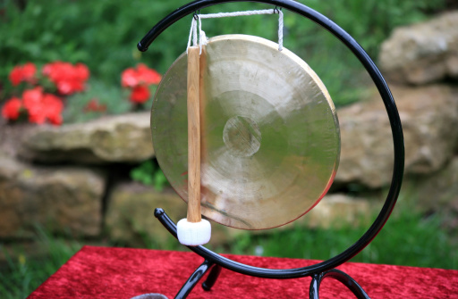 An asian gong with beater. Zen meditation background.