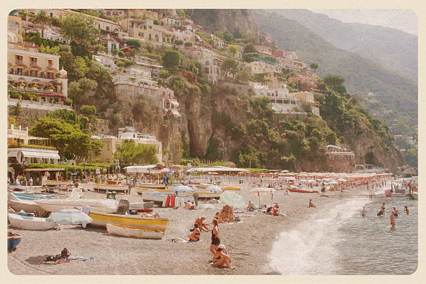 Positano Beach Day - Vintage Postcard "Retro-styled postcard of the Amalfi Coast (Positano, Italy)." coastline photos stock pictures, royalty-free photos & images