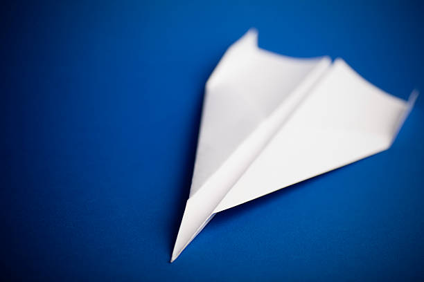 istock Paper airplane on blue background 182782203