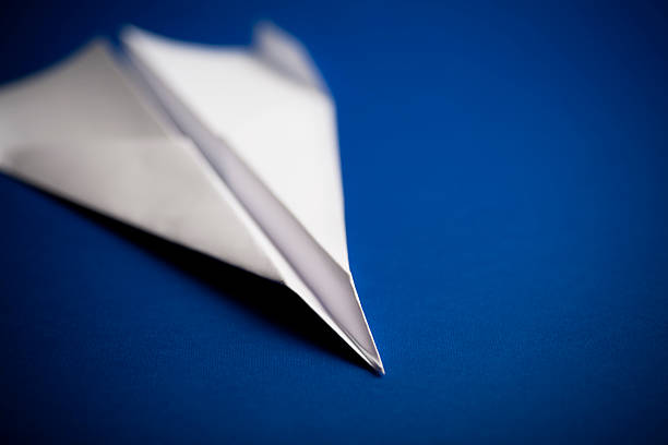 istock Paper airplane on blue background 182782223