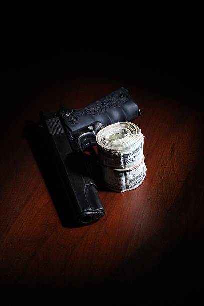 istock Roll of Cash and a .45 182782348