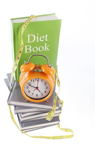 減量をご予約ください。 - book stack dieting textbook ストックフォトと画像