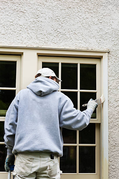 istock House Painter Standing on Ladder Painting Window Trim Vt 182784308