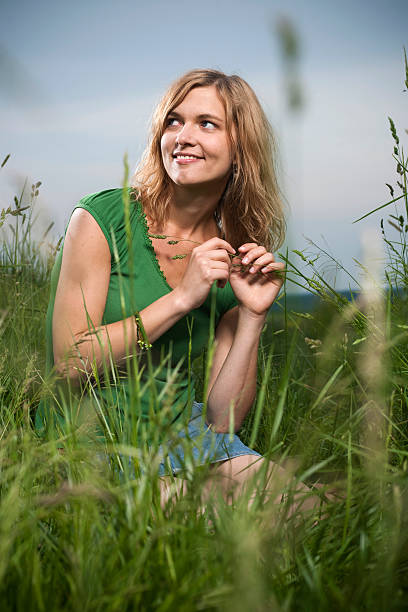 istock Young woman in the meadow 182784334
