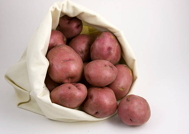istock Red Potatoes in a Canvas Bag 182784490