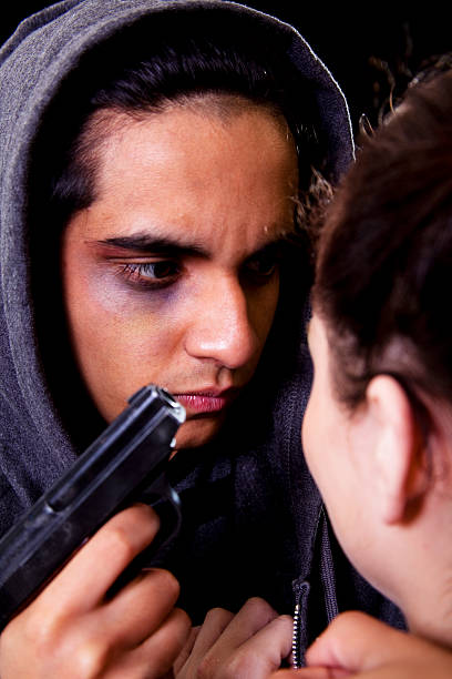 istock Middle Eastern male threatening caucasian female with gun 182784980