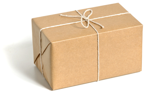 Brown wrapped parcel isolated on white. No sharpening.