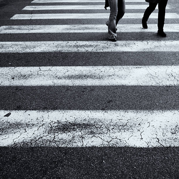 istock Two People Crossing in a Crosswalk 182785561