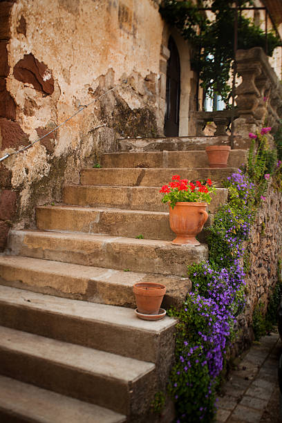 Stairs and flowers in the beautiful and old town of Cesme, Turkey.