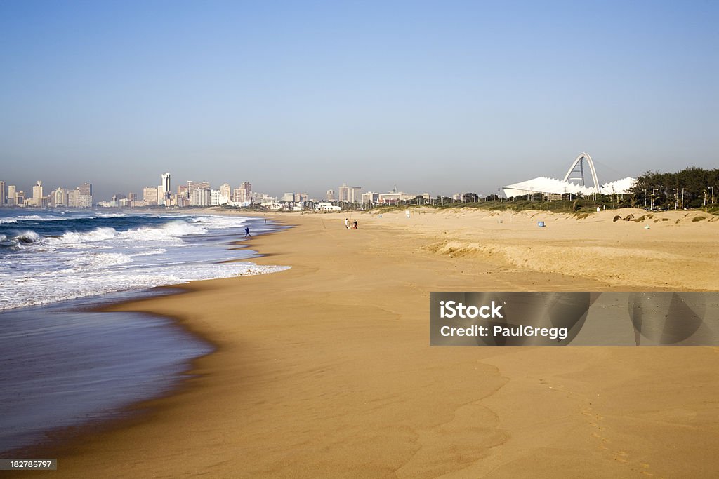 Durban's Moses Mabhida Stadium from the beach South Africa A view along the Northern beaches towards Durban's golden mile with the city in the background and the world cup stadium Moses Mabhida to the right.Here are similar world cup images. Durban Stock Photo