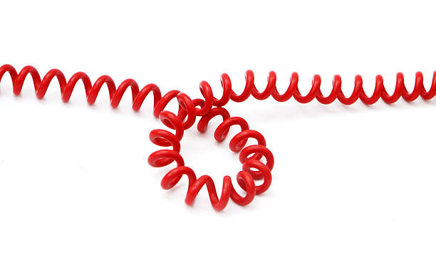 Pile of audio cables with jack plugs isolated against white background