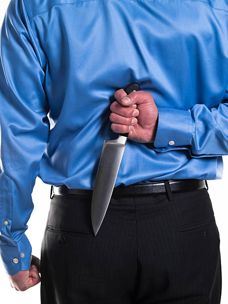 istock Businessman with knife 182786373