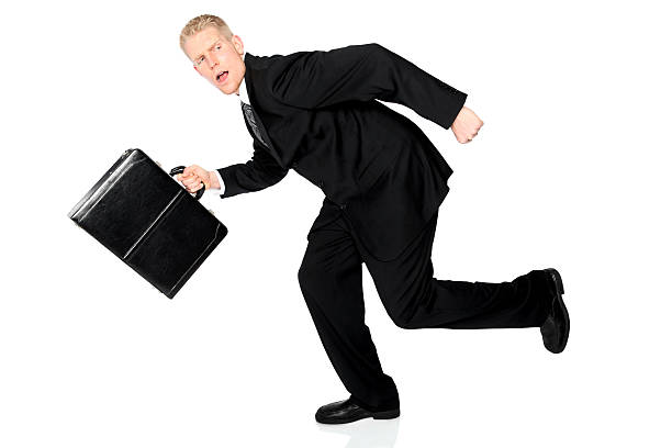 istock Businessman running with briefcase being chased 182786395