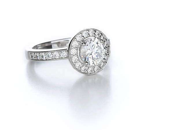 Diamond Ring A contemporary diamond ring. Round brilliant center stone with pave accents. engagement ring stock pictures, royalty-free photos & images