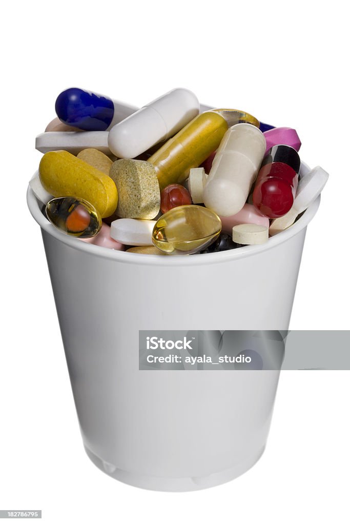 Plastic Cup Full of Pills Capsule - Medicine Stock Photo