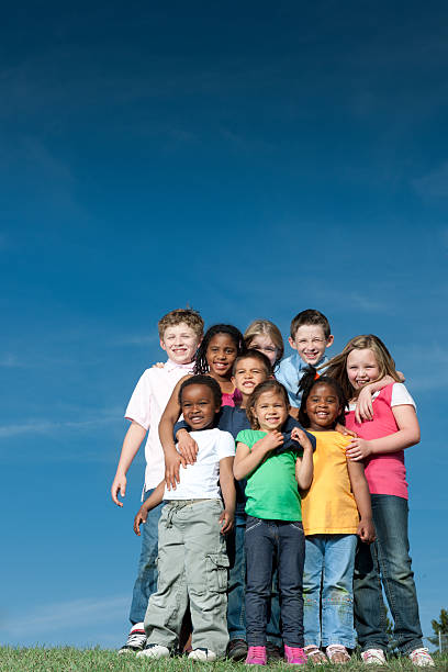 Children A diverse group of children outside - Buy credits human age child multi ethnic group group of people stock pictures, royalty-free photos & images