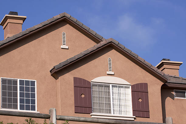 istock Mocha Brown Stucco Home Exterior and  Blue Sky 182787907