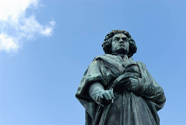 Statue of Ludwig van Beethoven against the bright blue sky