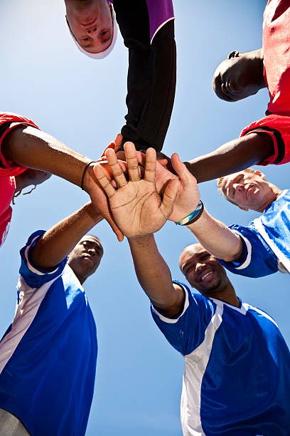 istock Soccer Team With Hands Together in Huddle 182788600