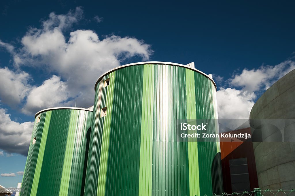 silos Green silos of biogas power plant against dark blue sky (clean energy production). Find more in Zocha`s green Biogas Stock Photo