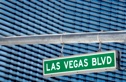 Las Vegas Blvd sign with thousands of hotel rooms in the background.  Please see my portfolio for other gambling related images.