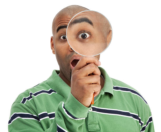 istock Surprised Man with Magnifying Glass 182790110