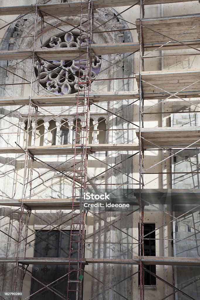 Church restauration Construction site with Scaffolding on church to restore the facade Basilica Stock Photo