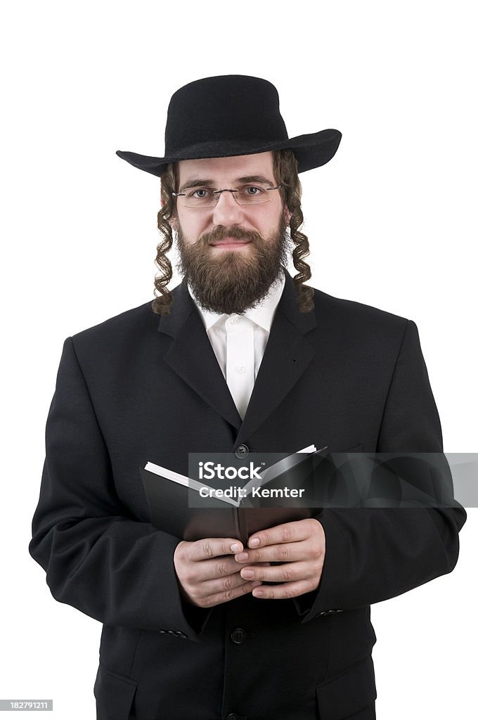 rabbi holding a book smiling rabbi looking at camera - isolated on white Judaism Stock Photo
