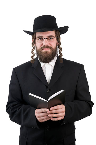 rabbi holding a book smiling rabbi looking at camera - isolated on white rabbi photos stock pictures, royalty-free photos & images