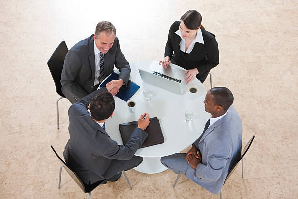 istock arial view of Business Group Working on a laptop 182791324