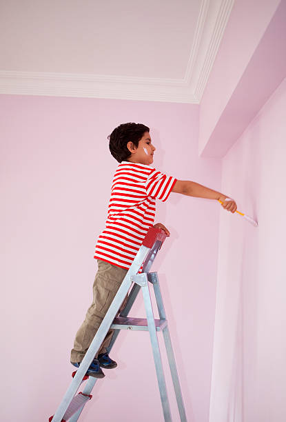 istock Little boy painting 182791361