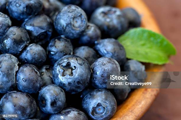 Fresh Blueberries With Green Leaf Accent In Bowl Stock Photo - Download Image Now - Blueberry, Antioxidant, Crop - Plant