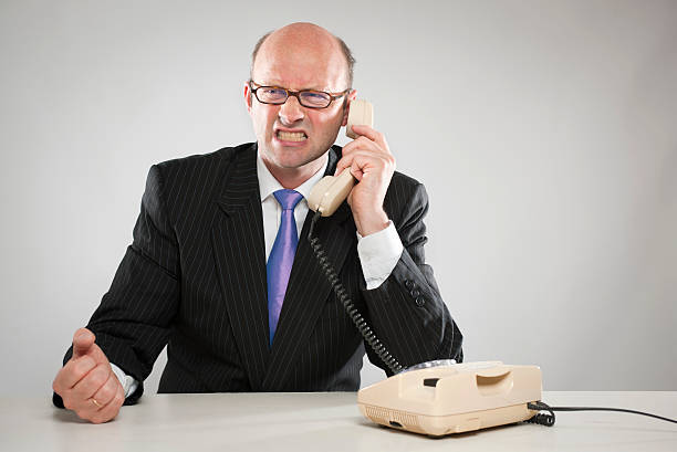 istock Angry businessman with telephone 182792146