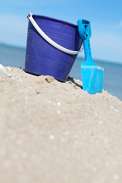 istock Toy Pail and Shovel in Sand at Beach 182792314