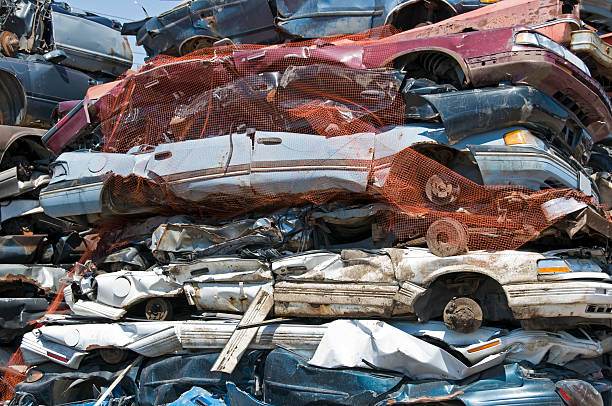 istock Cars crushed and stacked for recycling 182792394